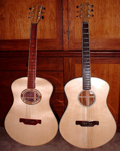 Two type A  A body style guitars.  Lutz spruce tops. Bloodwood fret board on left. Ebony on right.